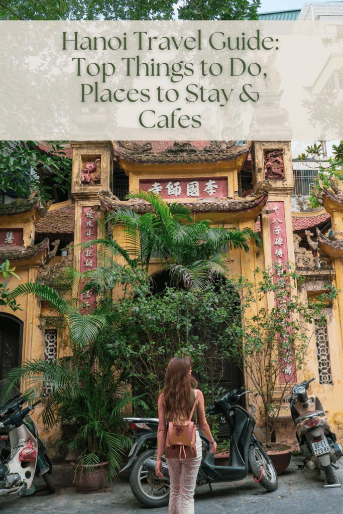 Woman walking toward scooter through busy Hanoi Old Quarter street with motorbikes, featuring burned-in text overlay reading 'Hanoi Travel Guide: Top Things to Do, Places to Stay & Cafes' and 'read here' at bottom