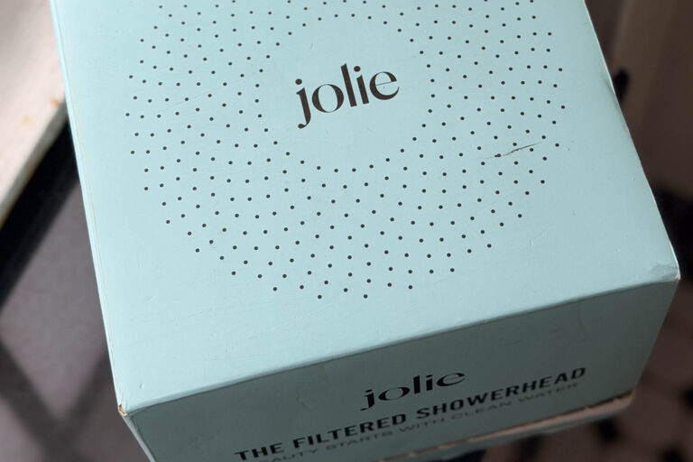 Jolie filtered showerhead packaging in soft mint green with minimalist branding and clean modern design. Nastasia Yakoub. All rights reserved. No reposts, reuse, or distribution without written permission.